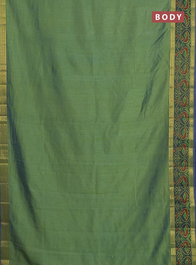 Semi tussar saree dual shade of greenish blue and blue with plain body and ikat woven zari border