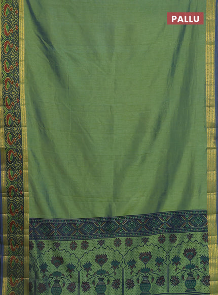 Semi tussar saree dual shade of greenish blue and blue with plain body and ikat woven zari border
