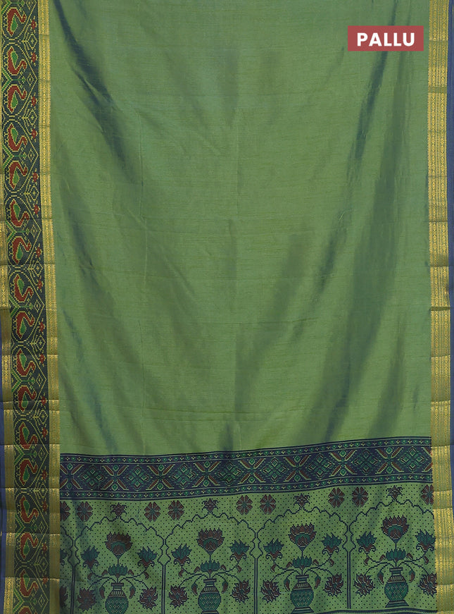 Semi tussar saree dual shade of greenish blue and blue with plain body and ikat woven zari border