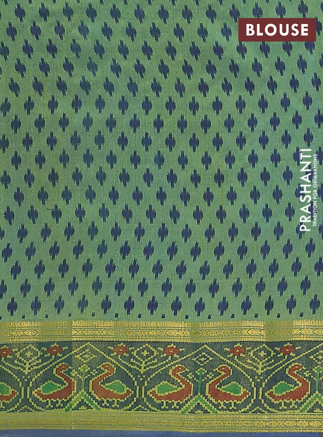 Semi tussar saree dual shade of greenish blue and blue with plain body and ikat woven zari border