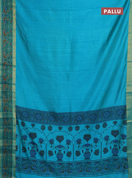 Semi tussar saree dual shade of teal blue and green with plain body and ikat woven zari border