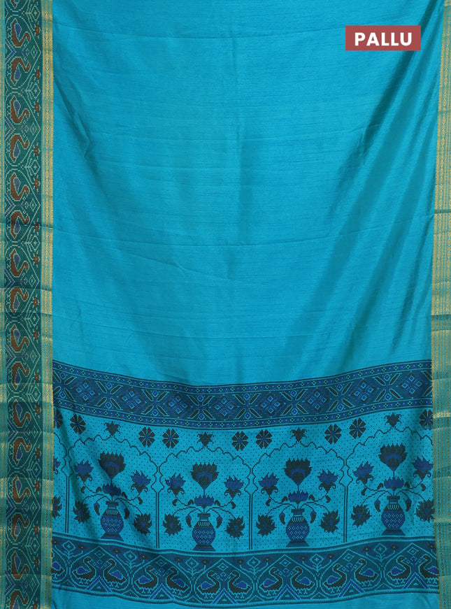 Semi tussar saree dual shade of teal blue and green with plain body and ikat woven zari border