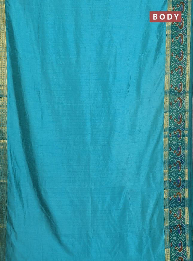 Semi tussar saree dual shade of teal blue and green with plain body and ikat woven zari border