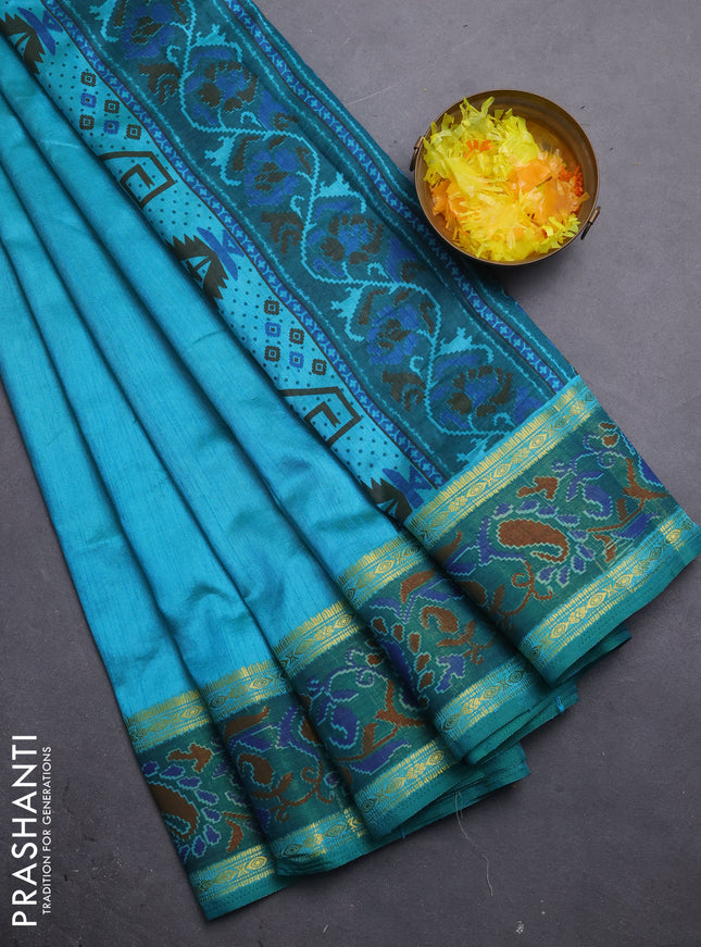 Semi tussar saree dual shade of teal blue and green with plain body and ikat woven zari border