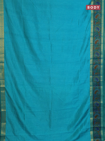 Semi tussar saree dual shade of teal blue and green with plain body and ikat woven zari border