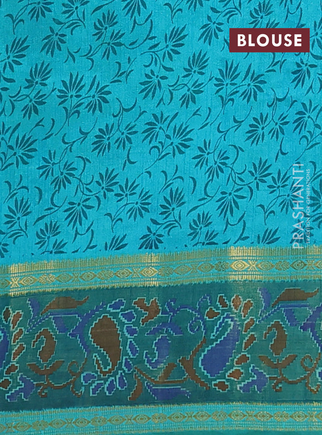 Semi tussar saree dual shade of teal blue and green with plain body and ikat woven zari border