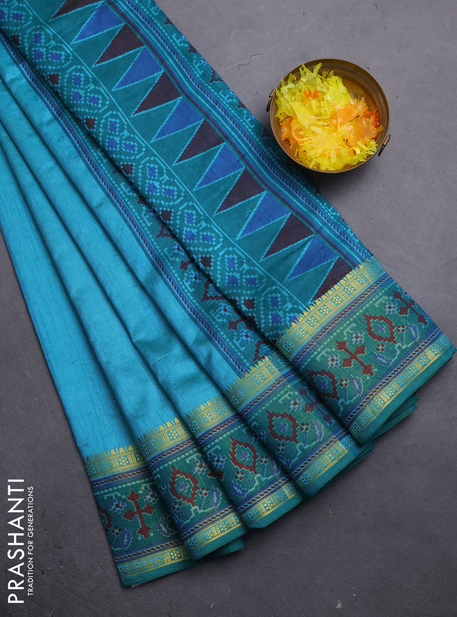 Semi tussar saree dual shade of teal blue and green with plain body and ikat woven zari border