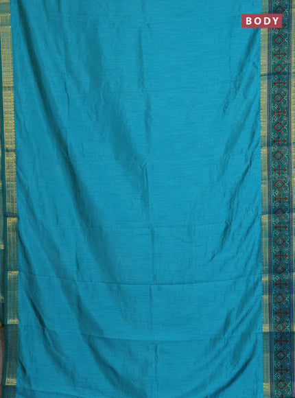 Semi tussar saree dual shade of teal blue and green with plain body and ikat woven zari border