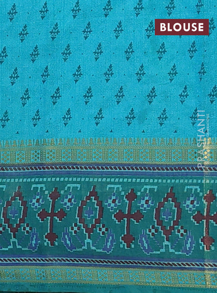 Semi tussar saree dual shade of teal blue and green with plain body and ikat woven zari border