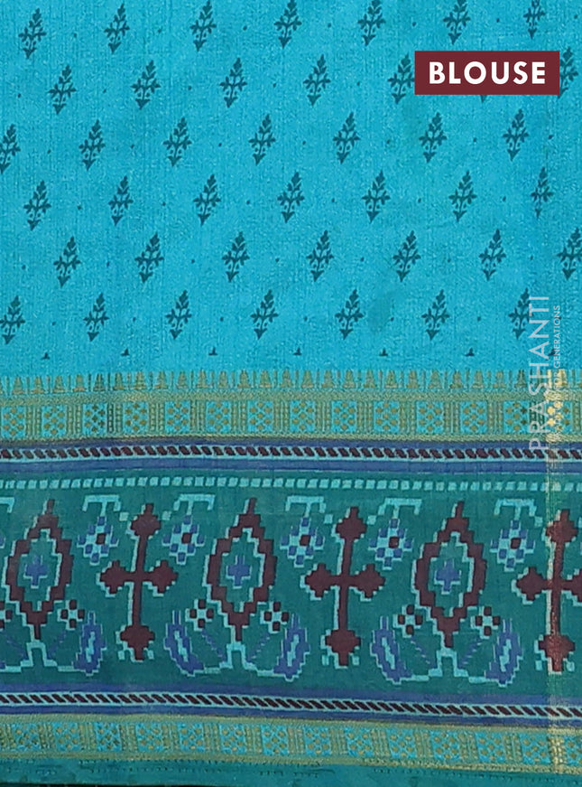 Semi tussar saree dual shade of teal blue and green with plain body and ikat woven zari border
