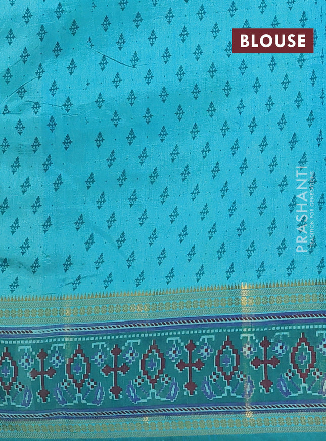 Semi tussar saree dual shade of teal blue and green with plain body and ikat woven zari border