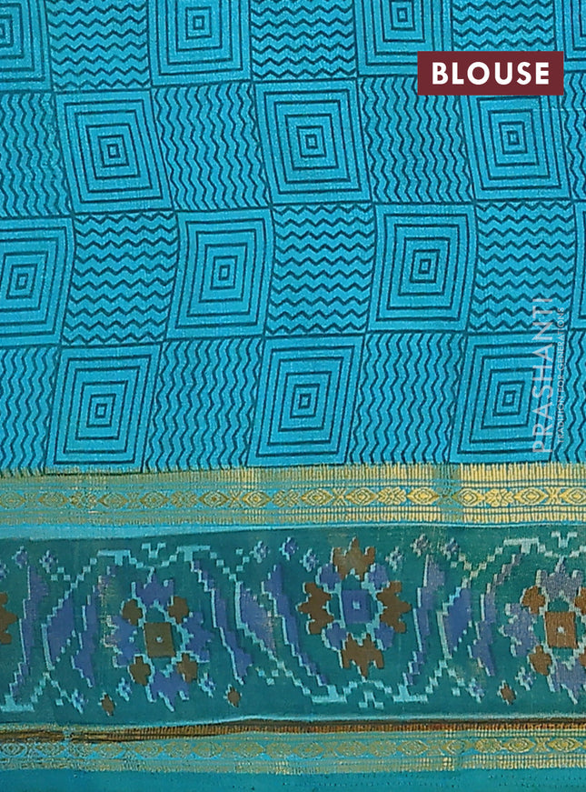 Semi tussar saree teal blue and green with plain body and ikat woven zari border