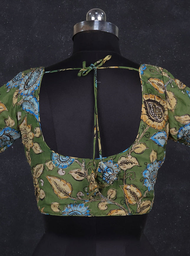 Silk penkalamkari readymade blouse green with allover kalamkari prints & pita work and back knot