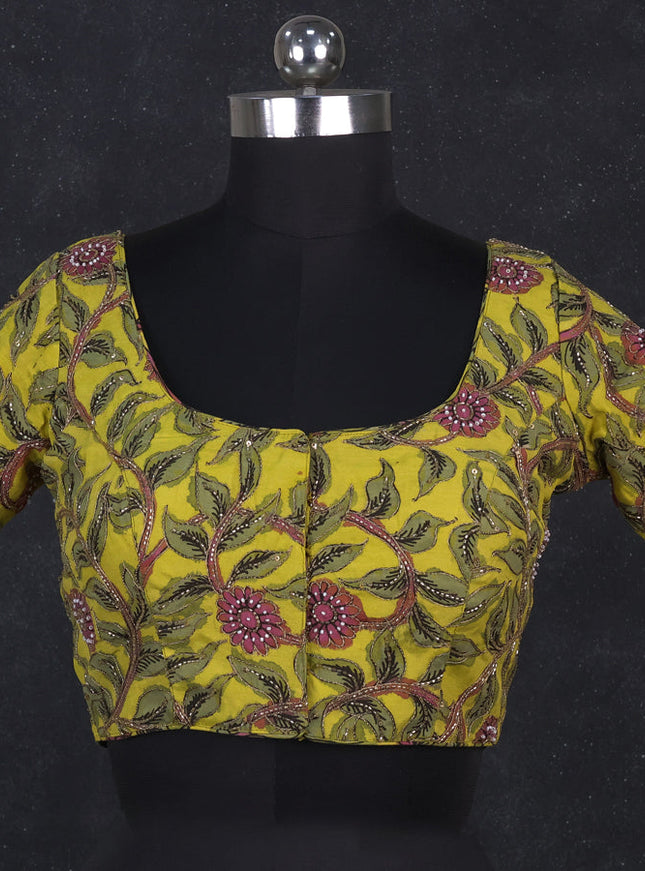 Silk penkalamkari readymade blouse lime yellow with allover kalamkari prints & pita work and back knot