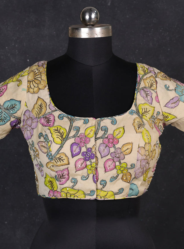 Silk penkalamkari readymade blouse cream with allover kalamkari prints & pita work and back knot