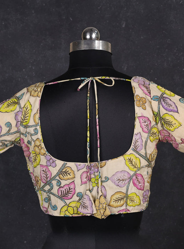 Silk penkalamkari readymade blouse cream with allover kalamkari prints & pita work and back knot