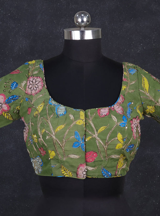 Silk penkalamkari readymade blouse green with allover kalamkari prints & pita work and back knot