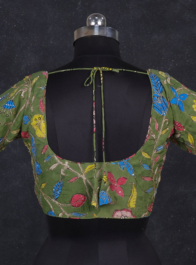 Silk penkalamkari readymade blouse green with allover kalamkari prints & pita work and back knot