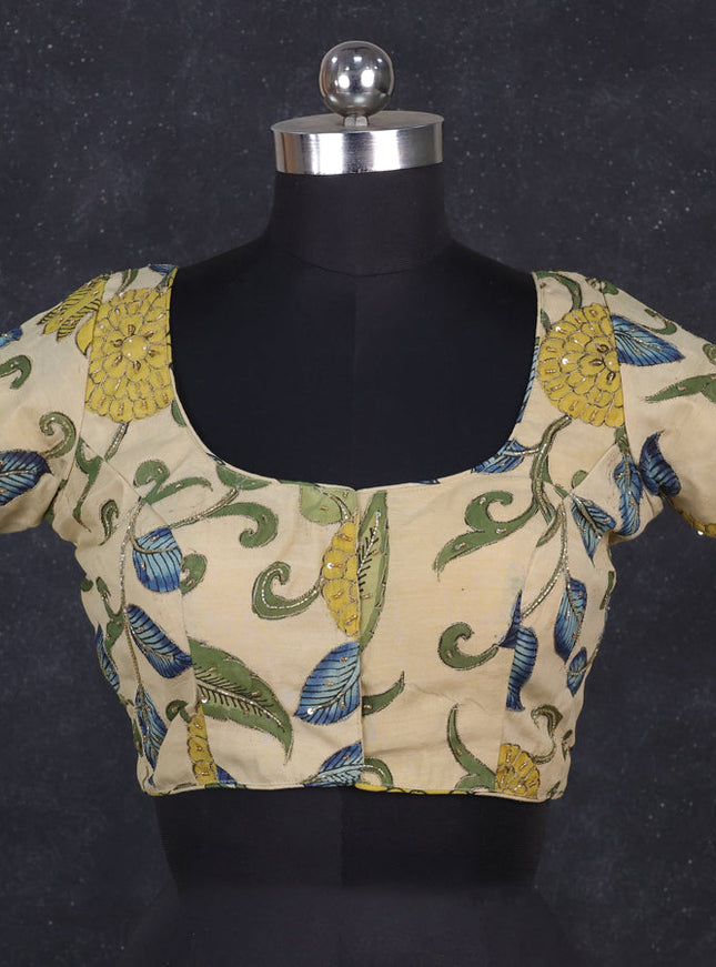 Silk penkalamkari readymade blouse cream with allover kalamkari prints & pita work and back knot