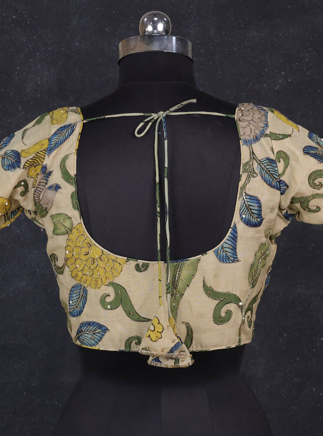 Silk penkalamkari readymade blouse cream with allover kalamkari prints & pita work and back knot