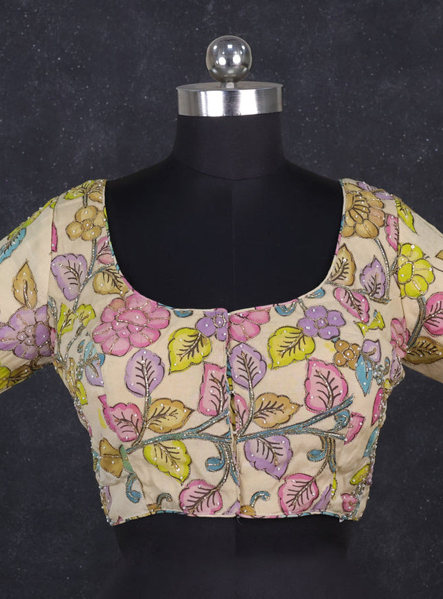 Silk penkalamkari readymade blouse cream with allover kalamkari prints & pita work and back knot