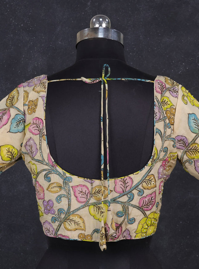 Silk penkalamkari readymade blouse cream with allover kalamkari prints & pita work and back knot