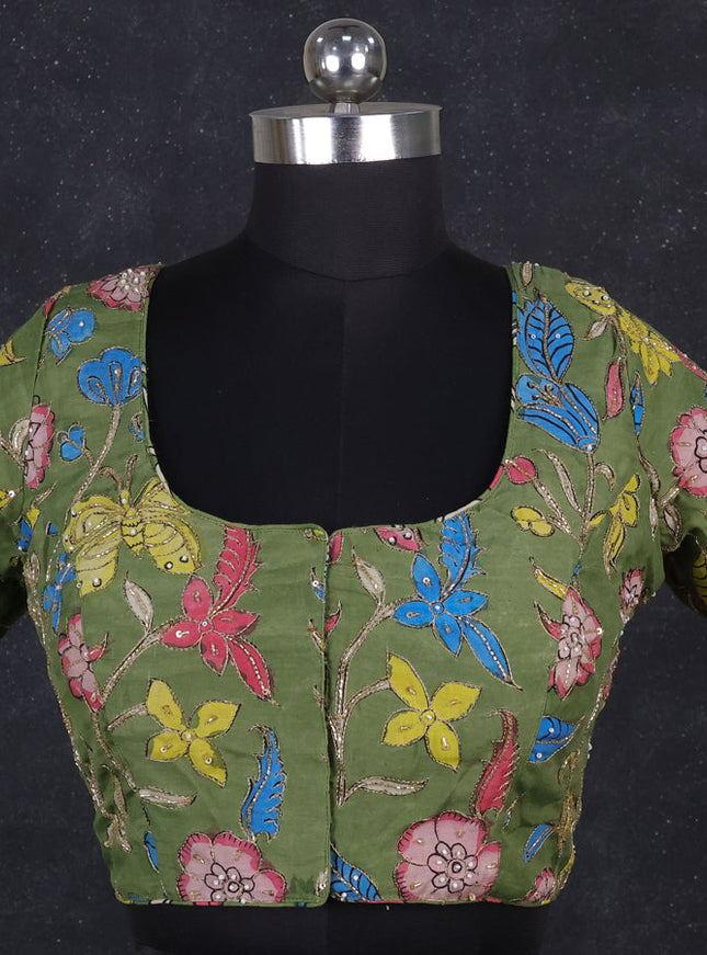 Silk penkalamkari readymade blouse green with allover kalamkari prints & pita work and back knot