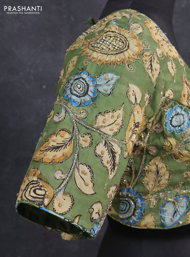 Silk penkalamkari readymade blouse green with allover kalamkari prints & pita work and back knot