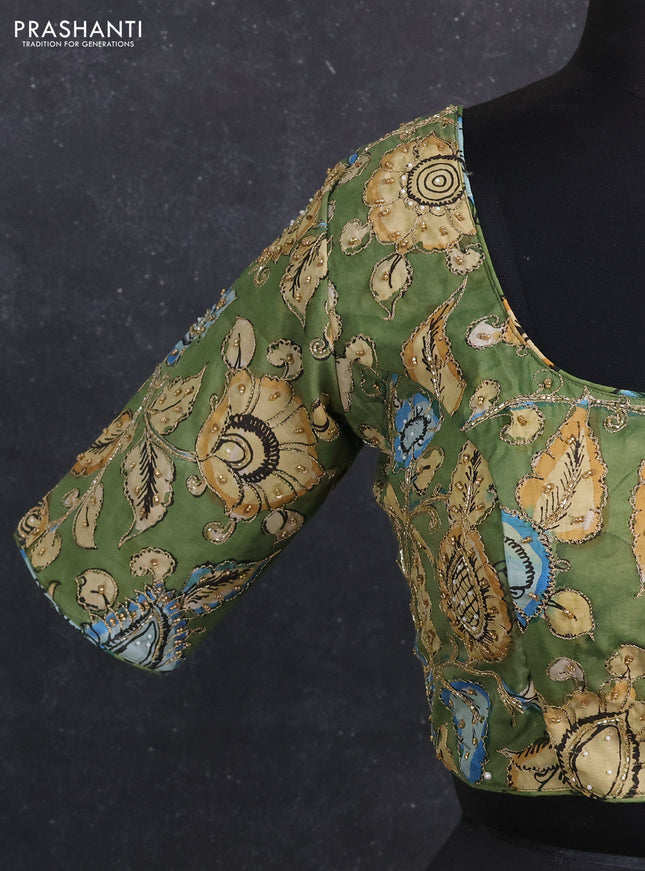 Silk penkalamkari readymade blouse green with allover kalamkari prints & pita work and back knot