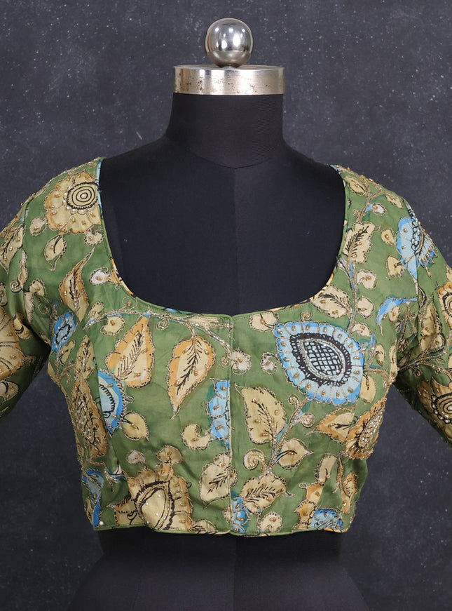 Silk penkalamkari readymade blouse green with allover kalamkari prints & pita work and back knot