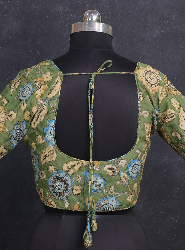 Silk penkalamkari readymade blouse green with allover kalamkari prints & pita work and back knot