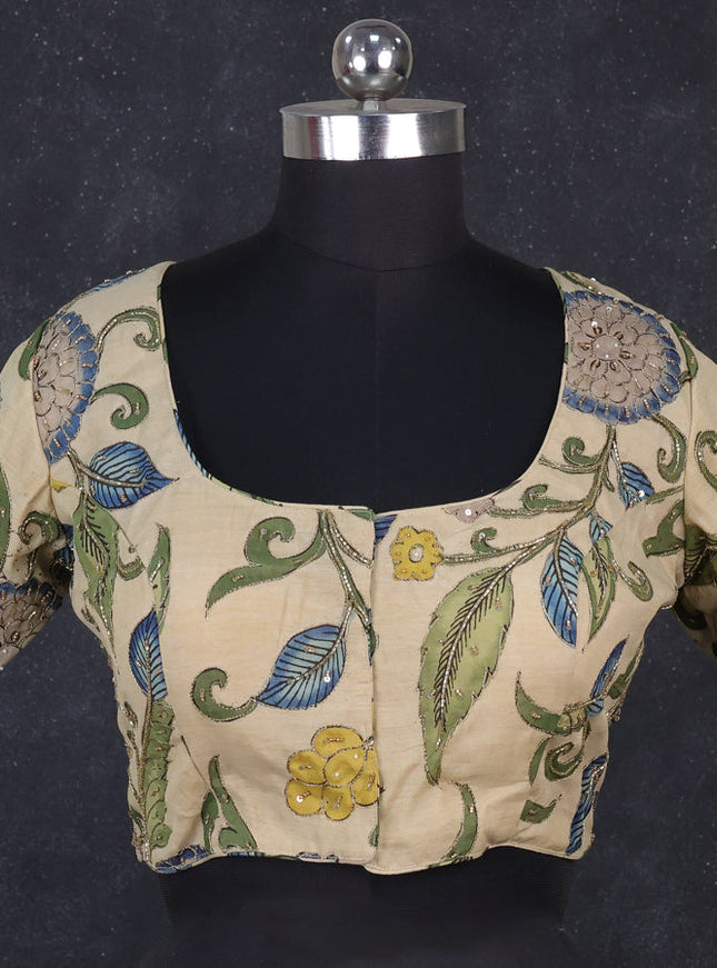 Silk penkalamkari readymade blouse cream with allover kalamkari prints & pita work and back knot