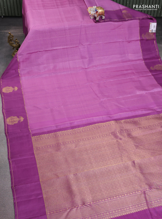 Pure kanchipuram silk saree lavender and purple shade with allover zari woven stripes pattern and zari woven butta border