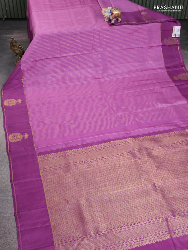 Pure kanchipuram silk saree lavender and purple shade with allover zari woven stripes pattern and zari woven butta border