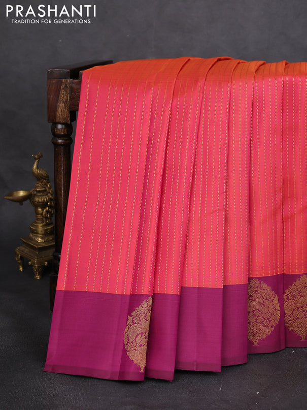 Pure kanchipuram silk saree dual shade of pinkish orange and magenta pink with allover zari woven stripes pattern and zari woven butta border