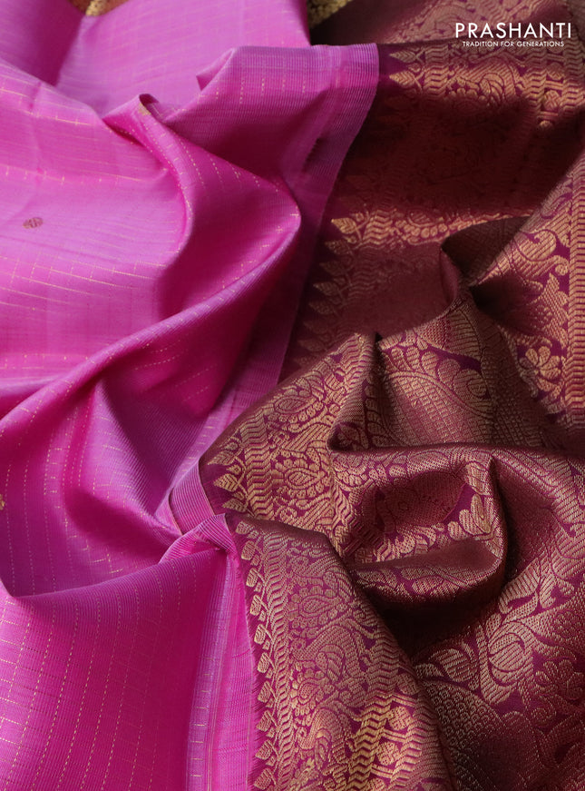 Pure kanchipuram silk saree lotus pink and dark magenta pink with allover zari checks & buttas and zari woven border