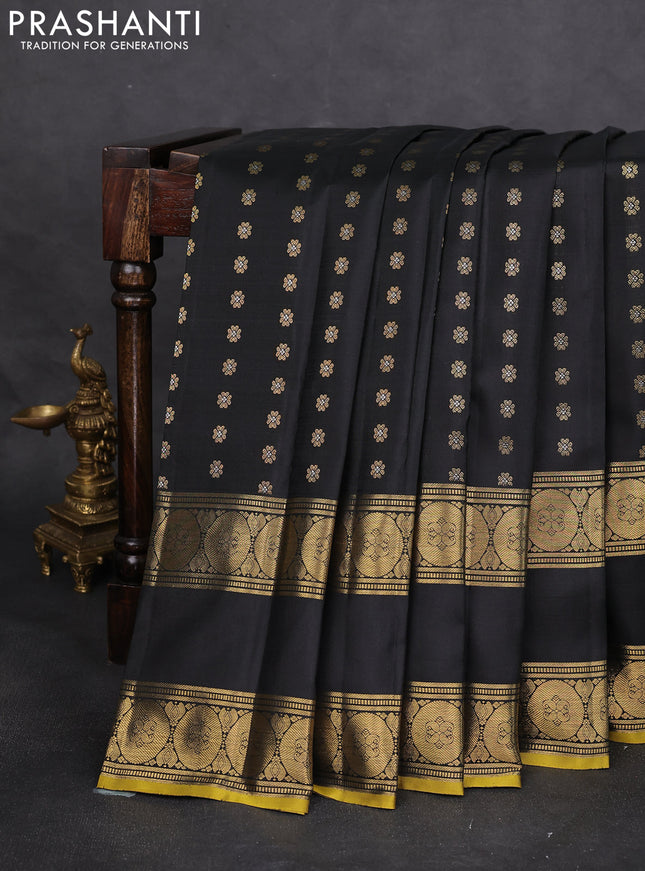 Pure kanchipuram silk saree black with allover zari woven floral buttas and rettapet zari woven border