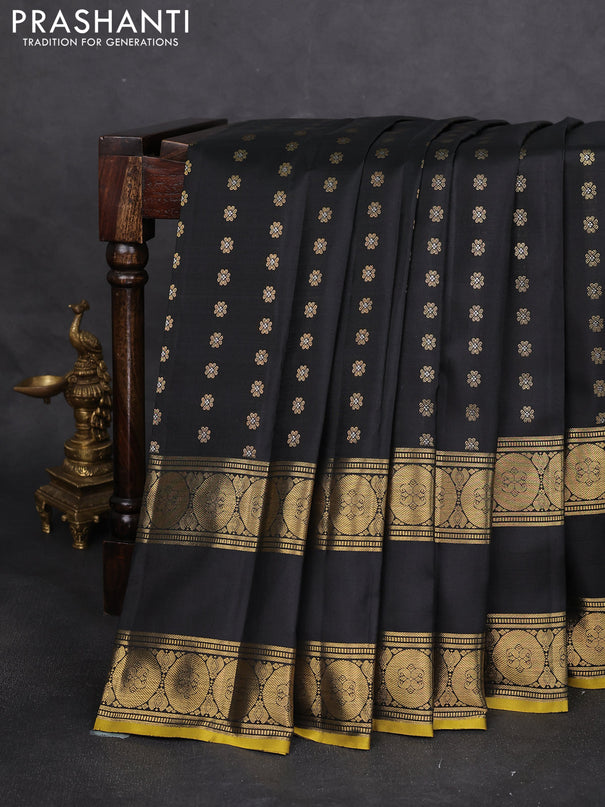 Pure kanchipuram silk saree black with allover zari woven floral buttas and rettapet zari woven border