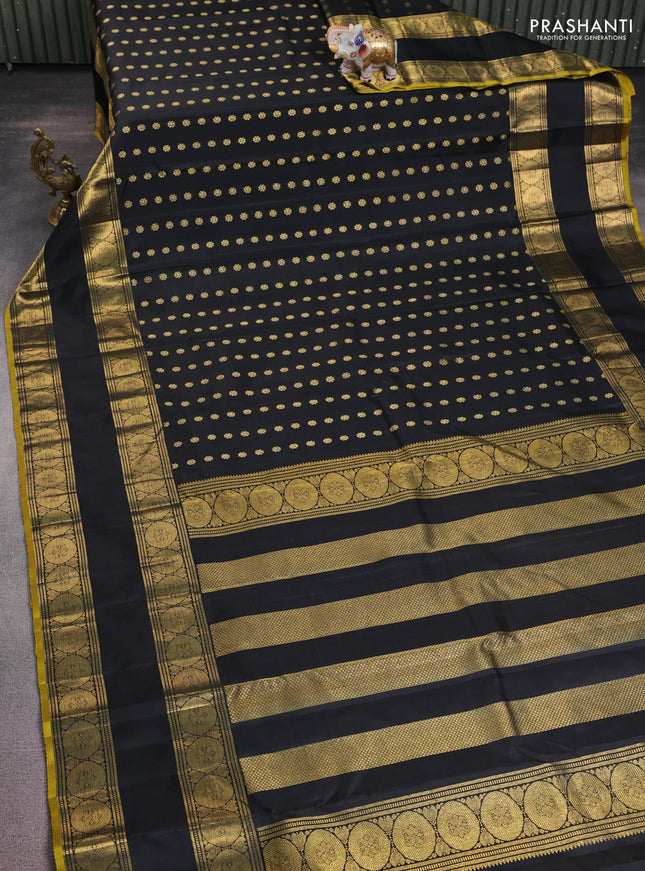 Pure kanchipuram silk saree black with allover zari woven floral buttas and rettapet zari woven border