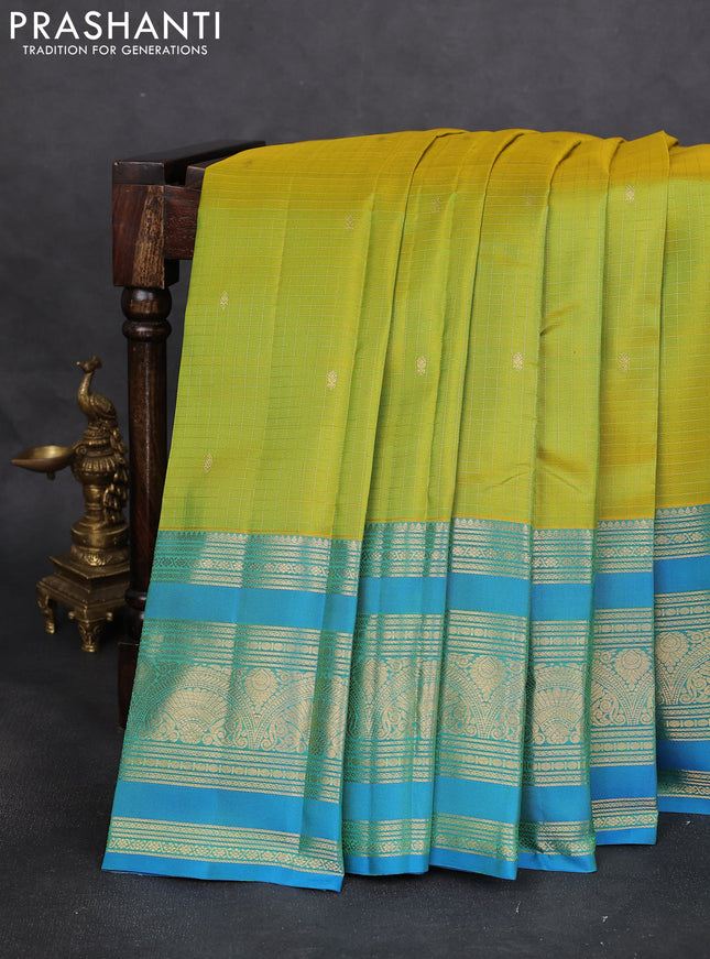 Pure kanchipuram silk saree fluorescent green and cs blue with allover zari checks & buttas and long zari woven border