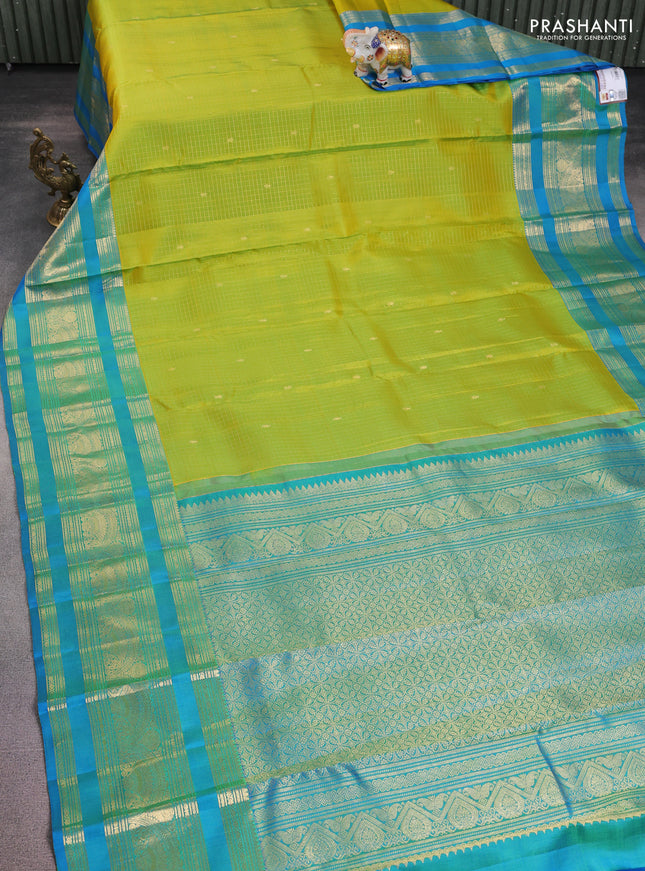 Pure kanchipuram silk saree fluorescent green and cs blue with allover zari checks & buttas and long zari woven border