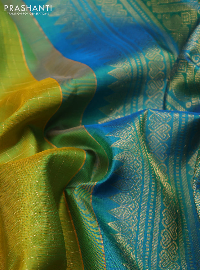 Pure kanchipuram silk saree fluorescent green and cs blue with allover zari checks & buttas and long zari woven border
