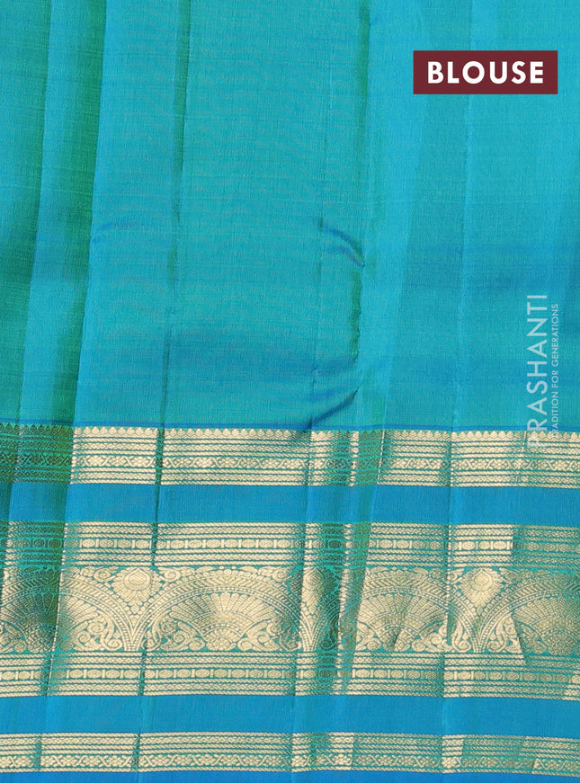 Pure kanchipuram silk saree fluorescent green and cs blue with allover zari checks & buttas and long zari woven border