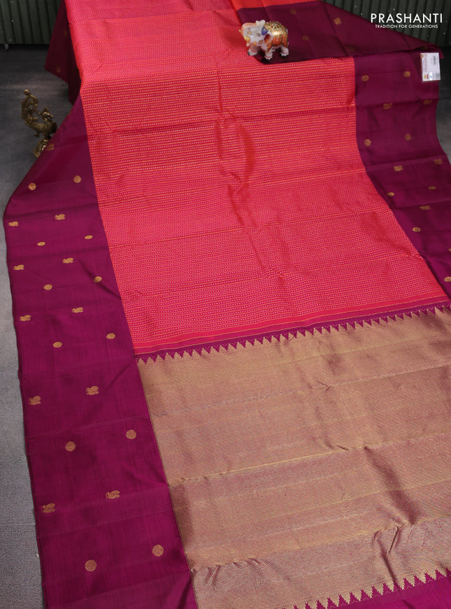 Pure kanchipuram silk saree dual shade of pinkish orange and dark magenta pink with allover silver & gold zari weaves and zari woven butta border