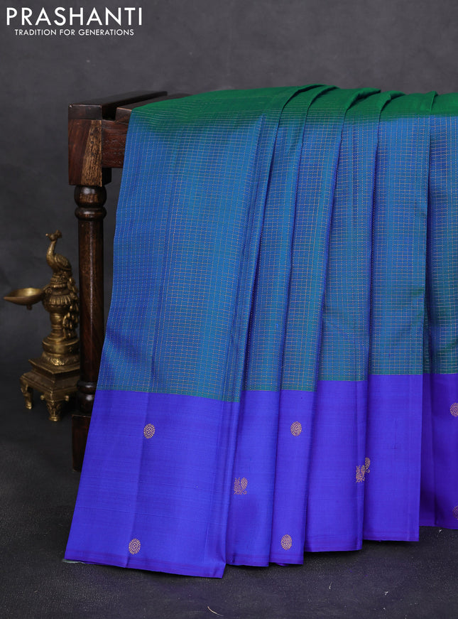 Pure kanchipuram silk saree dual shade of bluish green and royal blue with allover zari checks and zari woven butta border