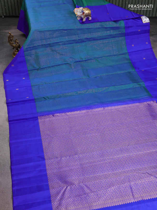 Pure kanchipuram silk saree dual shade of bluish green and royal blue with allover zari checks and zari woven butta border