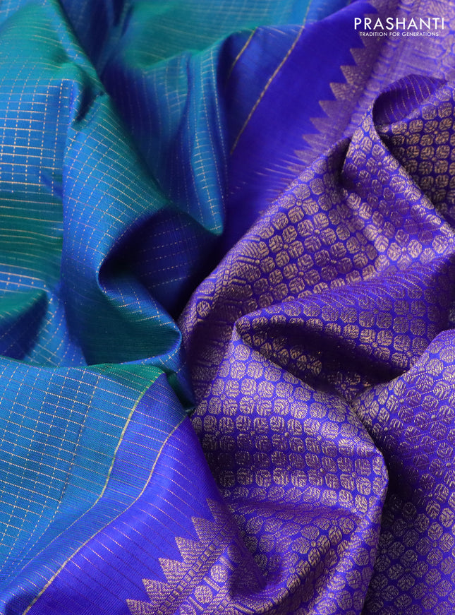Pure kanchipuram silk saree dual shade of bluish green and royal blue with allover zari checks and zari woven butta border