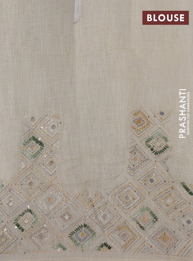 Tissue linen cotton saree cream and green with embroidery buttas and embroidery pallu