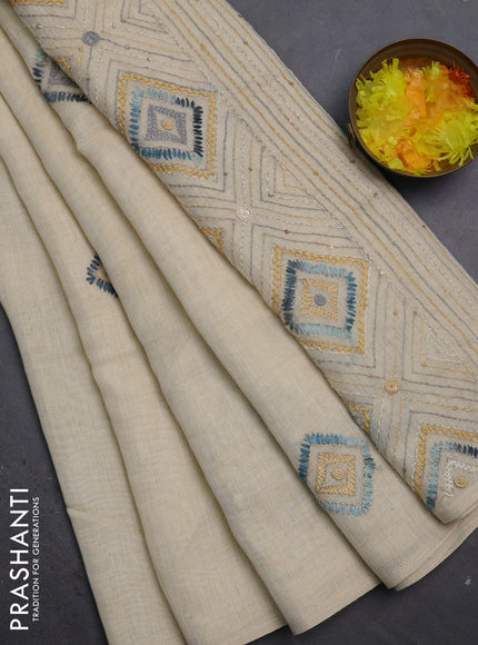 Tissue linen cotton saree cream and sandal with embroidery buttas and embroidery pallu