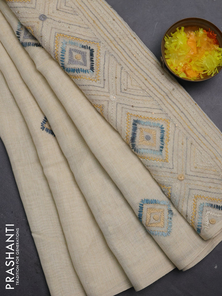 Tissue linen cotton saree cream and sandal with embroidery buttas and embroidery pallu